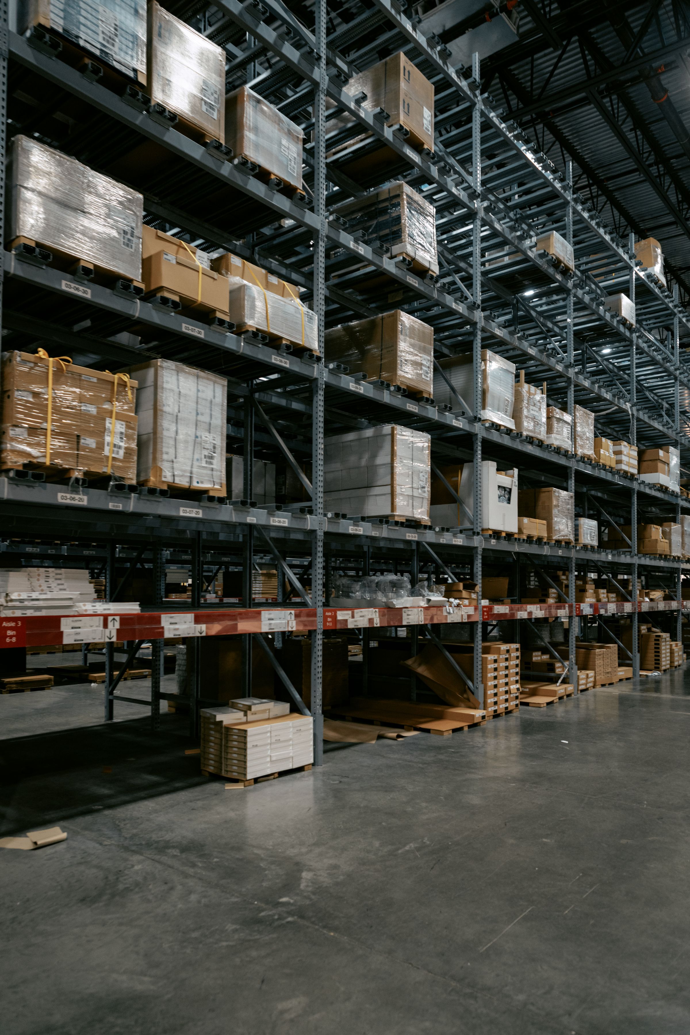 Warehouse interior with organized storage racks and palletized goods